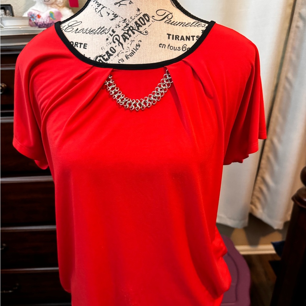 Red jeweled blouse